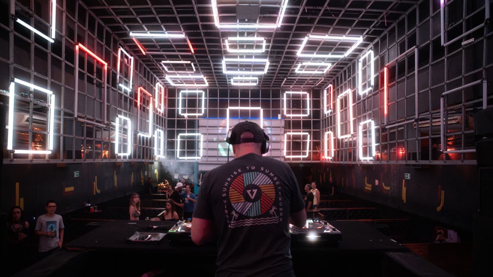 DJ inside an LED light cube